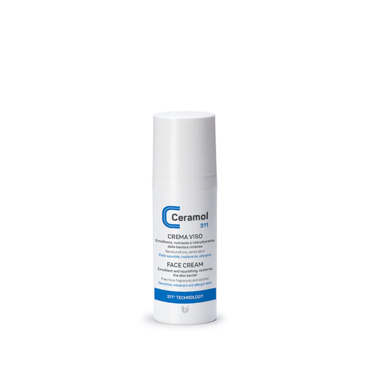 Ein weißer Flakon von CERAMOL GESICHTSCREME 311 der Hinterland Apotheke mit blauen und grauen Akzenten steht aufrecht auf weißem Grund, sein Etikett in italienischer und englischer Sprache vermerkt eine hautverträgliche Formel für trockene Haut.