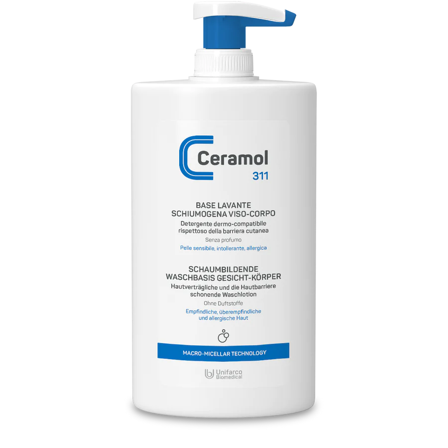 Eine weiße Pumpflasche CERAMOL SCHAUMBILDENDE WASCHBASIS 311 von Hinterland Apotheke, mit blauen Akzenten und italienischem/deutschem Etikett - geeignet für empfindliche, intolerante und zu Allergien neigende Haut.