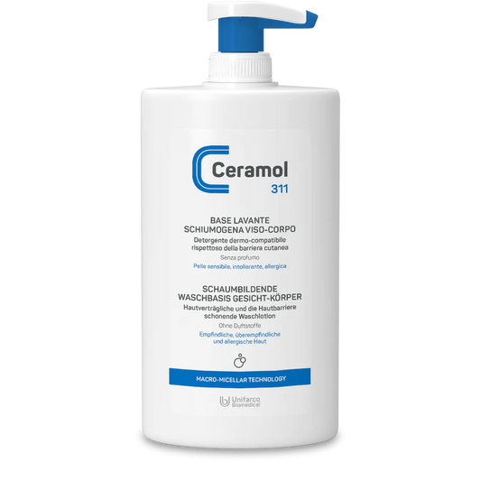 Eine weiße Pumpflasche CERAMOL SCHAUMBILDENDE WASCHBASIS 311 von Hinterland Apotheke, mit blauen Akzenten und italienischem/deutschem Etikett - geeignet für empfindliche, intolerante und zu Allergien neigende Haut.