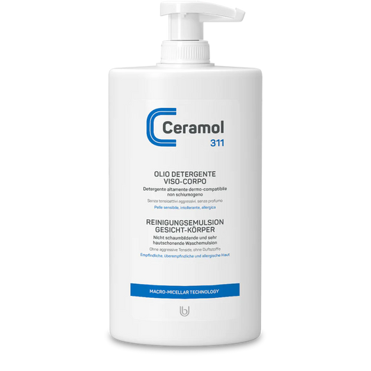 Weiße Pumpflasche der Hinterland Apotheke CERAMOL REINIGUNGSEMULSION GESICHT-KÖRPER 311, einer Reinigungsemulsion für empfindliche Haut, mit blauer und grauer italienischer und deutscher Schrift auf weißem Grund.