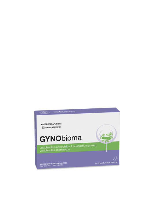 Eine Schachtel GYNObioma zeigt eine weiße, lila und grüne Verpackung mit "pflanzlichen Kapseln" und einer Auflistung von Laktobazillen-Stämmen wie Lactobacillus acidophilus, gasseri und rhamnosus.