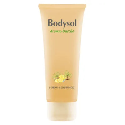 Eine gelbe Tube Bodysol Aromadusche LEMON-ZEDERNHOLZ mit Zitronen- und Zedernmotiven, angereichert mit natürlichen ätherischen Ölen und Panthenol zur sanften Reinigung.